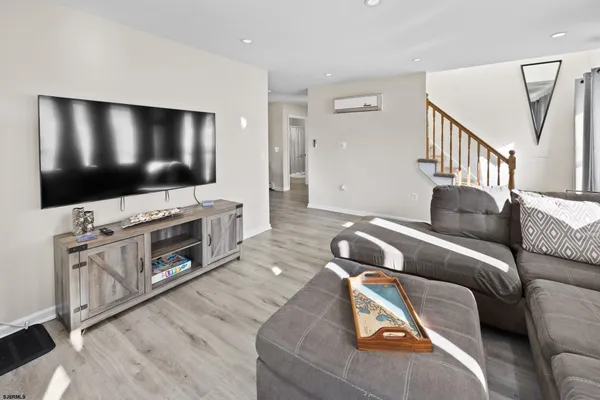 a kitchen with stainless steel appliances granite countertop a refrigerator and a stove