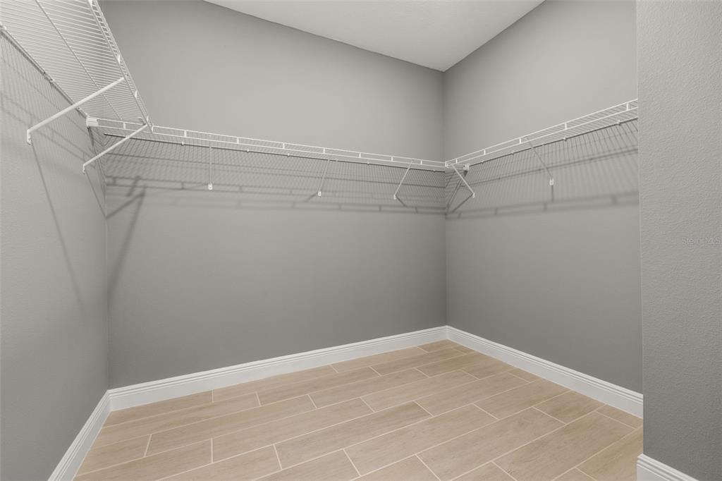 985 Fiesta Key Circle Lady Lake, FL 32159 - Photo 13 of 34 a view of a room with racks on the wall