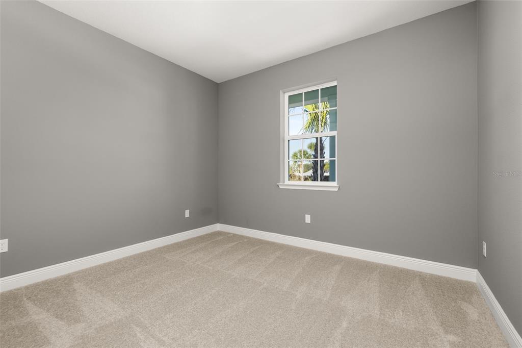 985 Fiesta Key Circle Lady Lake, FL 32159 - Photo 18 of 34 an empty room with windows