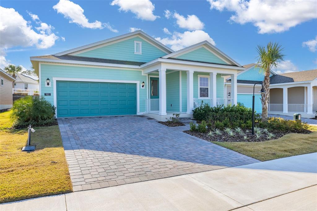 985 Fiesta Key Circle Lady Lake, FL 32159 - Photo 2 of 34 a front view of a house with garden
