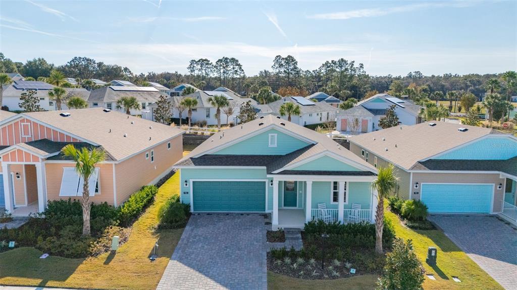 985 Fiesta Key Circle Lady Lake, FL 32159 - Photo 23 of 34 a aerial view of a house in a big yard with plants