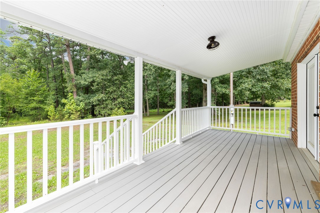 27523 Flank Road Petersburg, VA 23805 - Photo 3 of 34 Covered porch featuring gray wood-finish flooring,