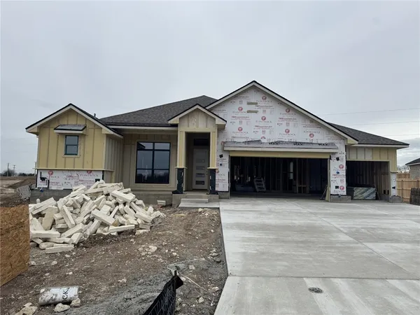 a front view of a house with yard