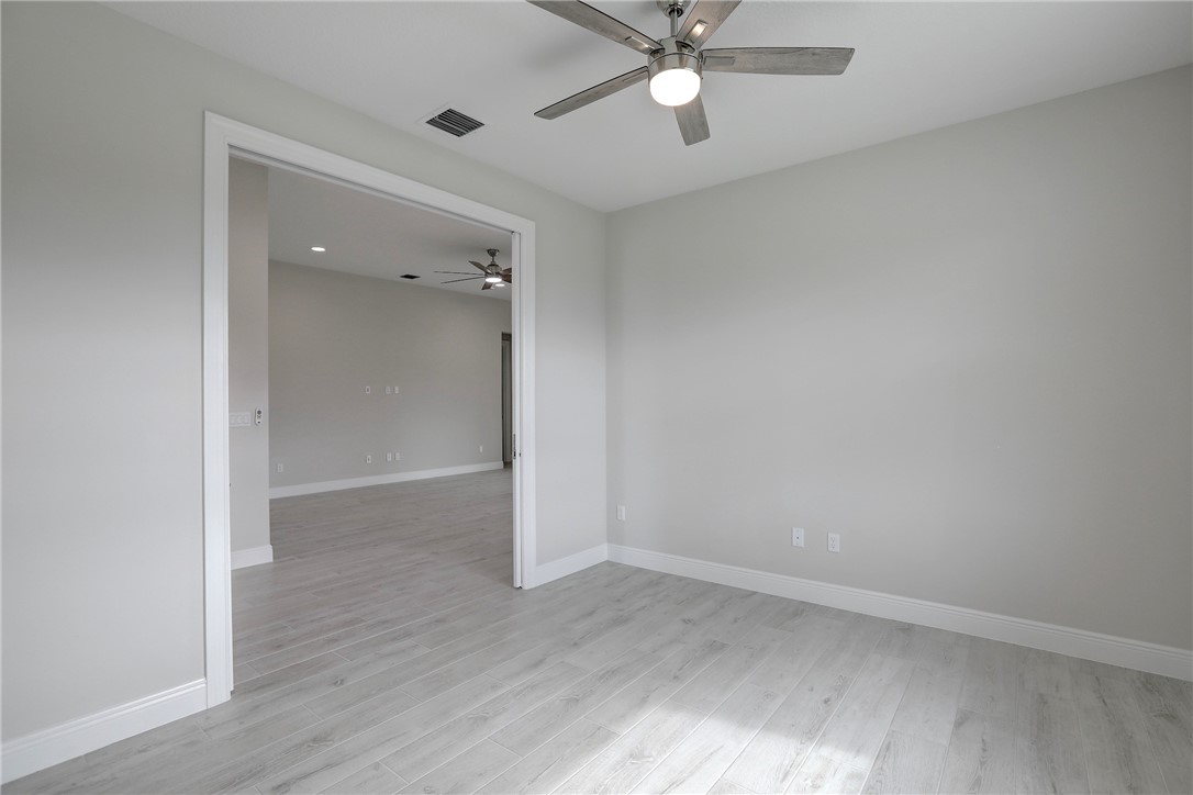 6423 High Pointe Circle Vero Beach, FL 32967 - Photo 14 of 36 wooden floor in an empty room