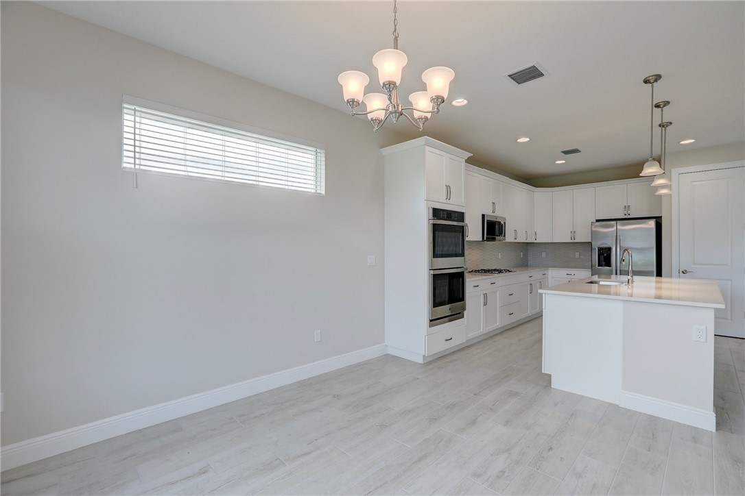 6423 High Pointe Circle Vero Beach, FL 32967 - Photo 20 of 36 a view of a kitchen with a sink and cabinet area
