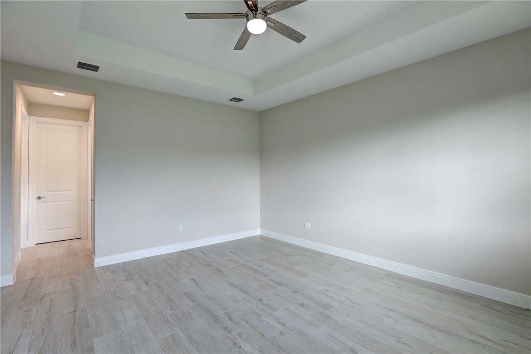 6423 High Pointe Circle Vero Beach, FL 32967 - Photo 23 of 36 a view of an empty room with wooden floor