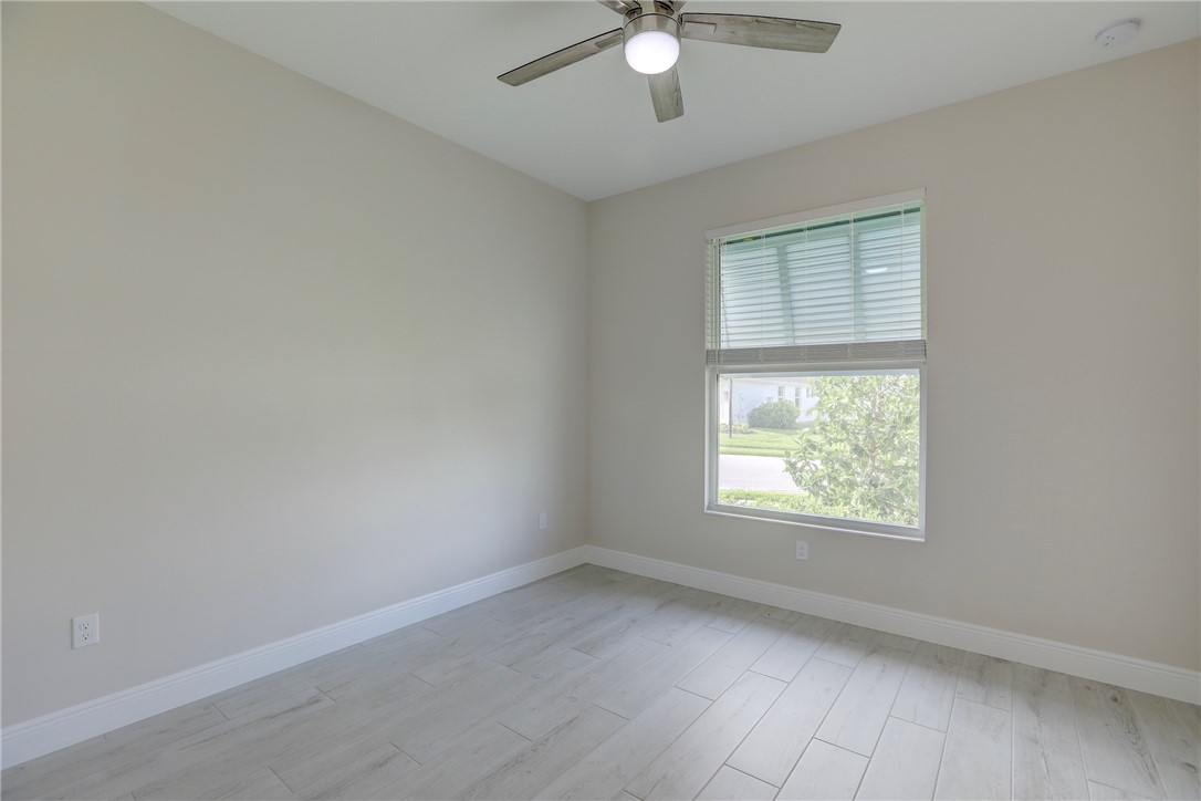 6423 High Pointe Circle Vero Beach, FL 32967 - Photo 28 of 36 an empty room with a window
