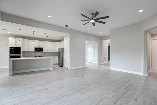 a view of kitchen with cabinets and wooden floor