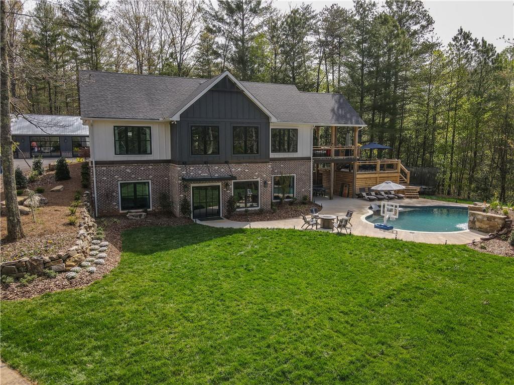 620 Damascus Road Blue Ridge, GA 30513 - Photo 1 of 1 a front view of a house with a yard table and chairs