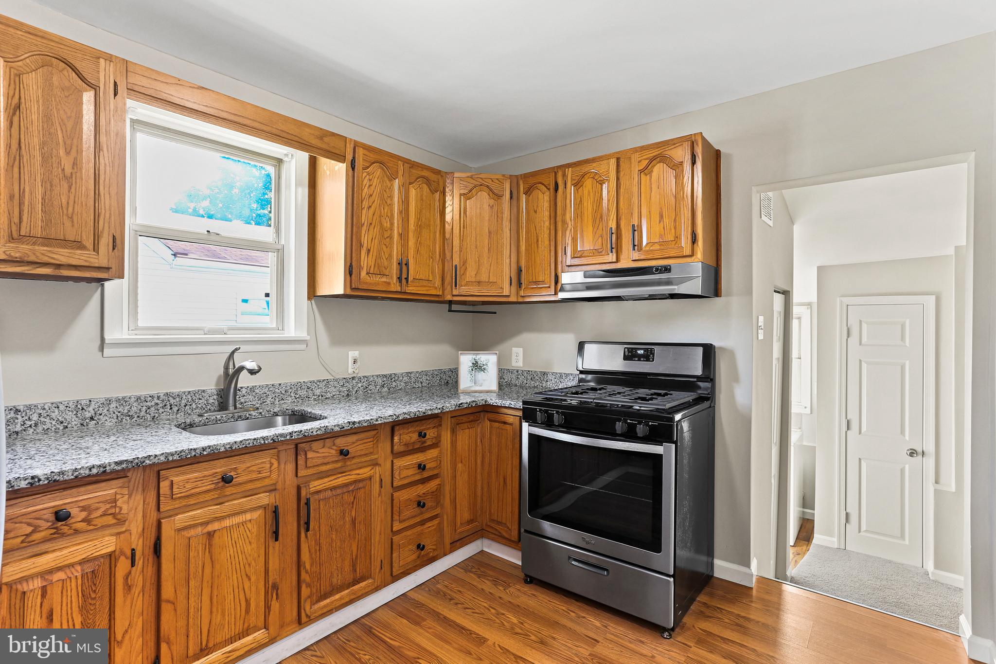 1710 Brookview Road Dundalk, MD 21222 - Photo 6 of 34 Granite countertops and stainless steel appliances