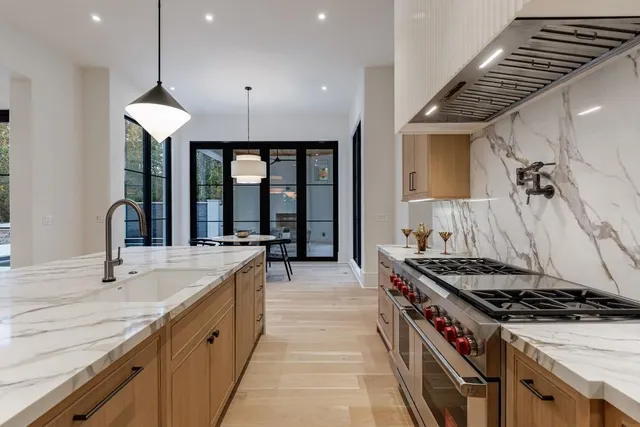 a bathroom with a double vanity sink a toilet a mirror and vanity