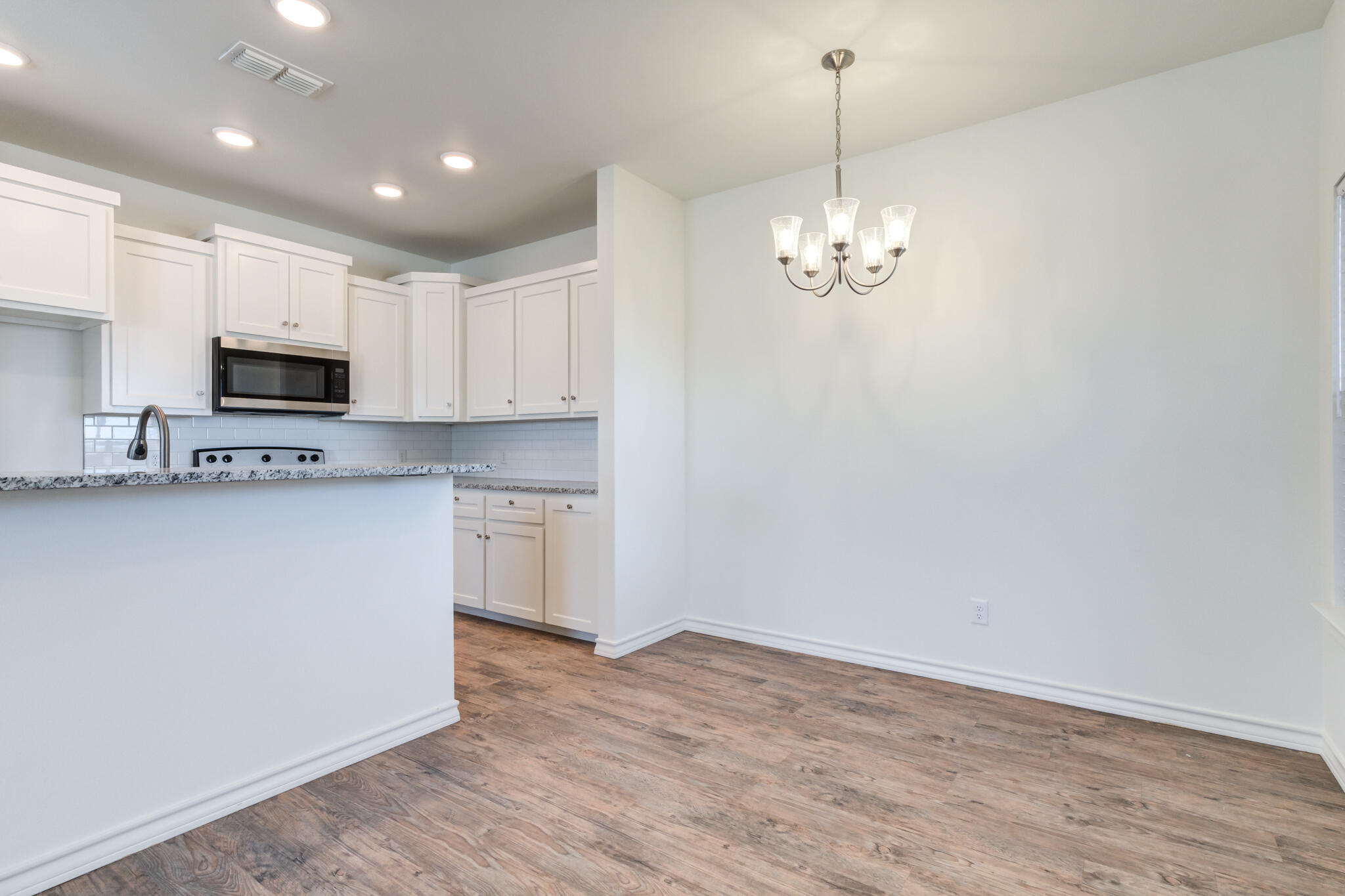 1207 Bryan Avenue Wolfforth, TX 79382 - Photo 6 of 30 Dining area and kitchen
