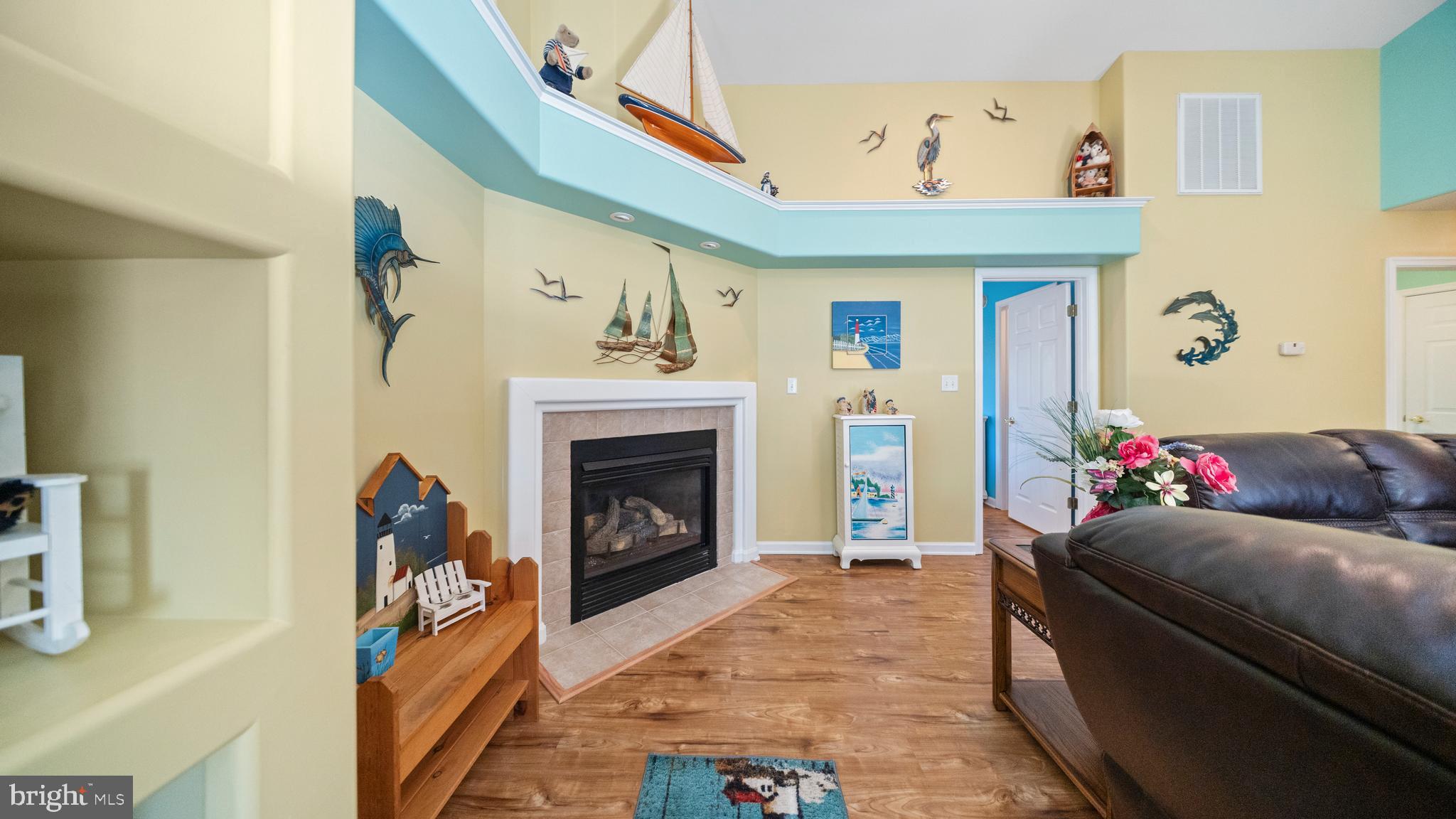 128 Sandyhook Road Ocean Pines, MD 21811 - Photo 11 of 37 a living room with furniture and a fireplace