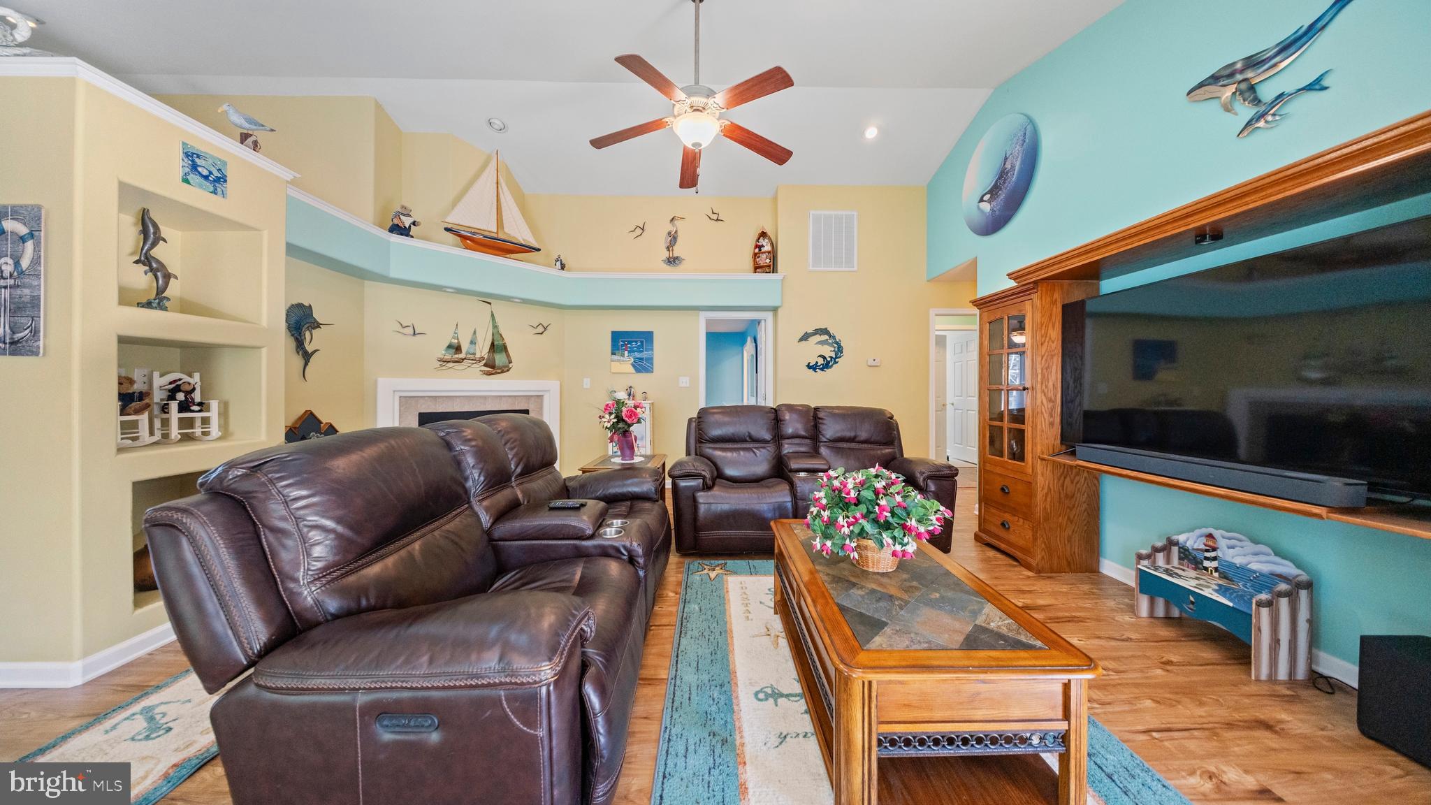 128 Sandyhook Road Ocean Pines, MD 21811 - Photo 13 of 37 a living room with furniture a flat screen tv and a dining table