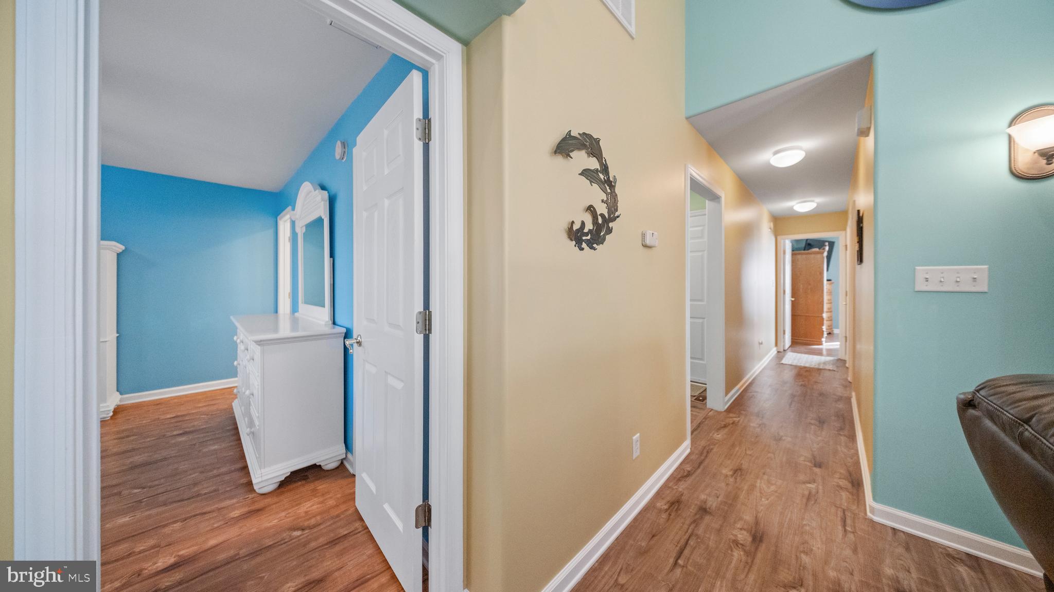 128 Sandyhook Road Ocean Pines, MD 21811 - Photo 17 of 37 a view of a hallway with wooden floor and staircase