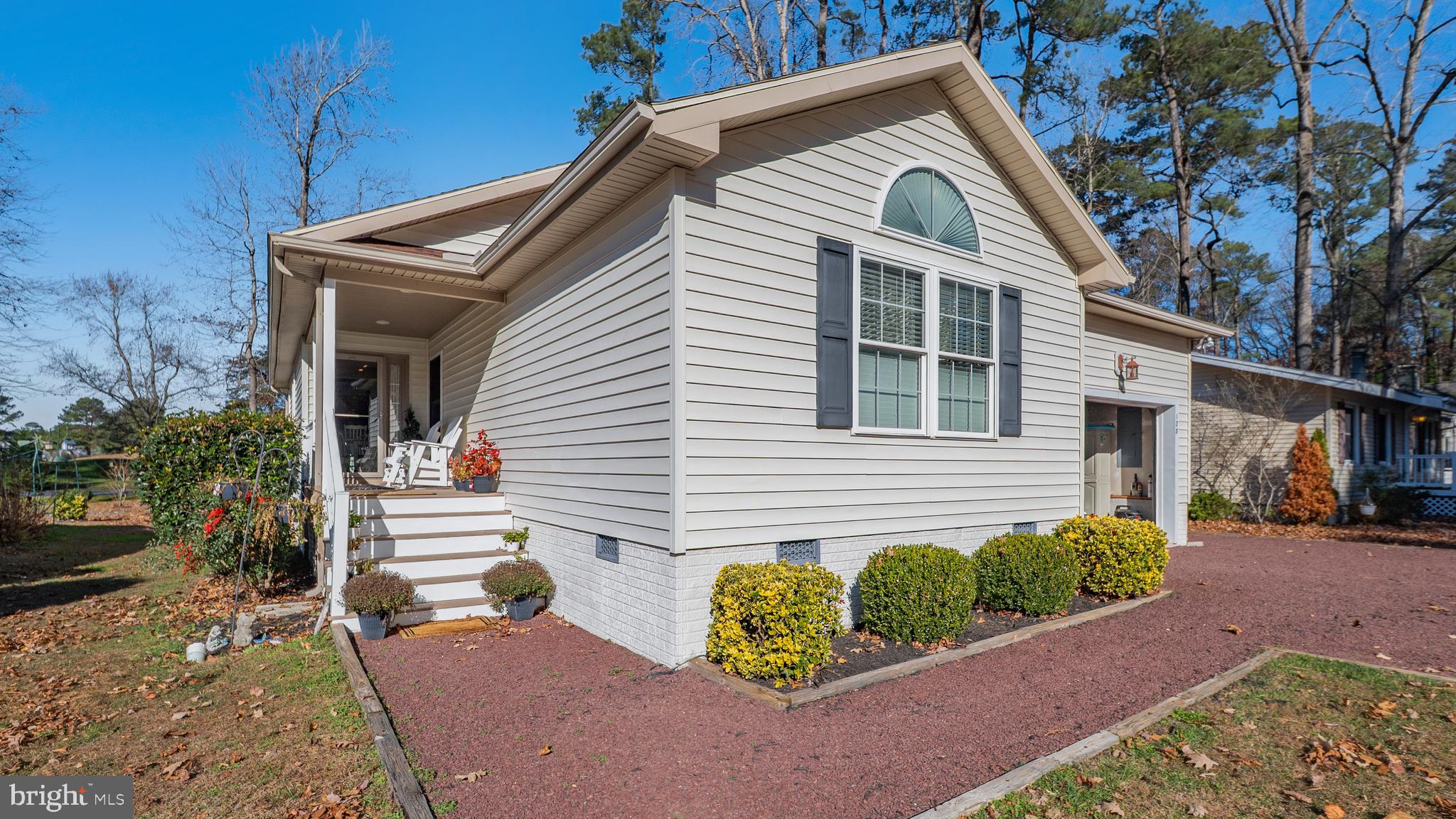128 Sandyhook Road Ocean Pines, MD 21811 - Photo 2 of 37 a front view of a house with a yard