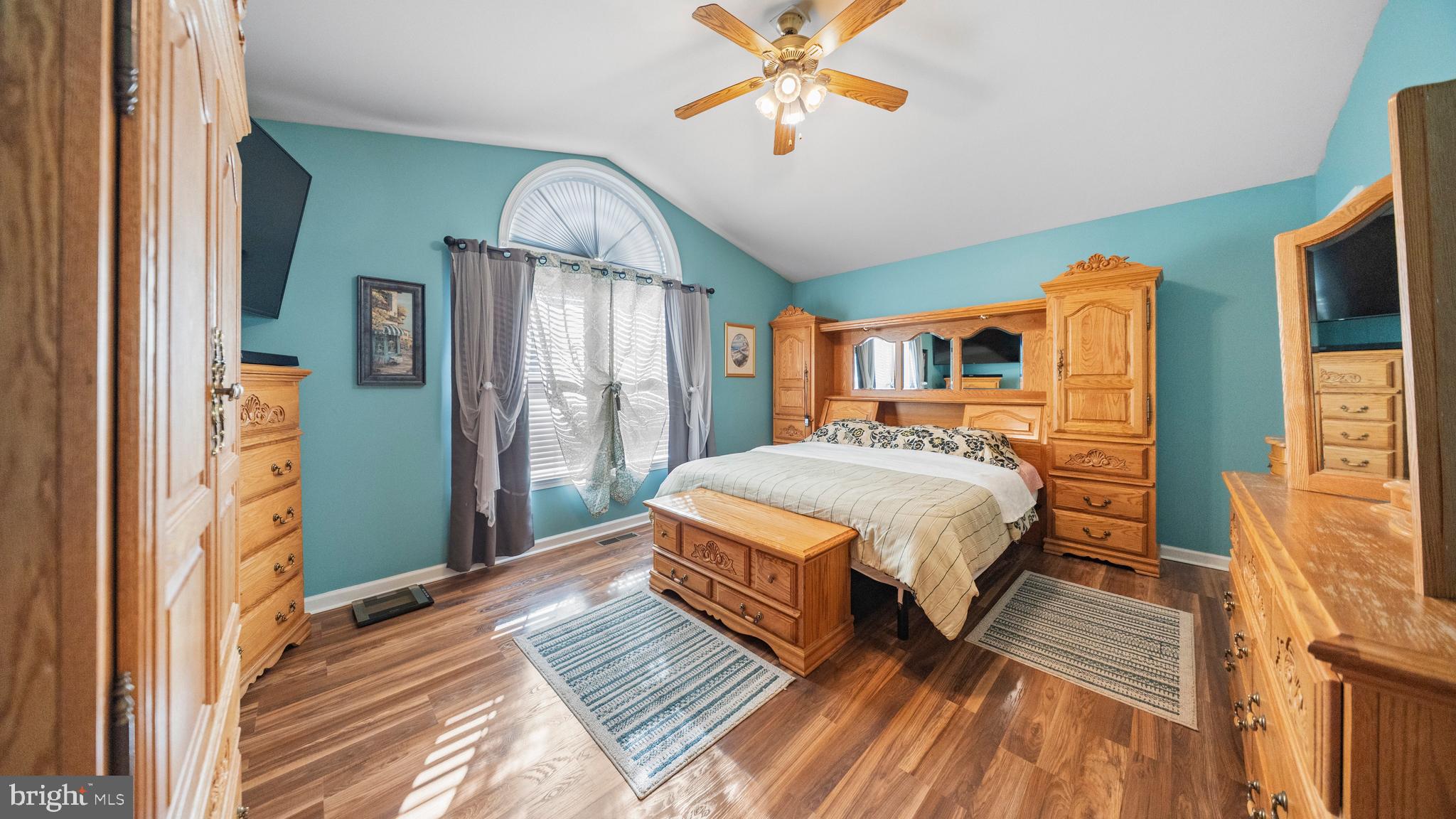 128 Sandyhook Road Ocean Pines, MD 21811 - Photo 21 of 37 a bedroom with a bed and wooden floor