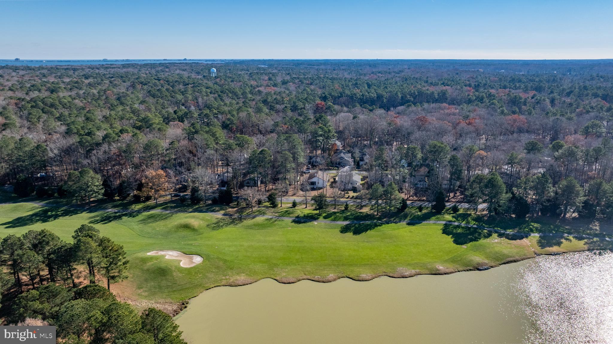 128 Sandyhook Road Ocean Pines, MD 21811 - Photo 34 of 37 an aerial view of a house with a yard and lake view