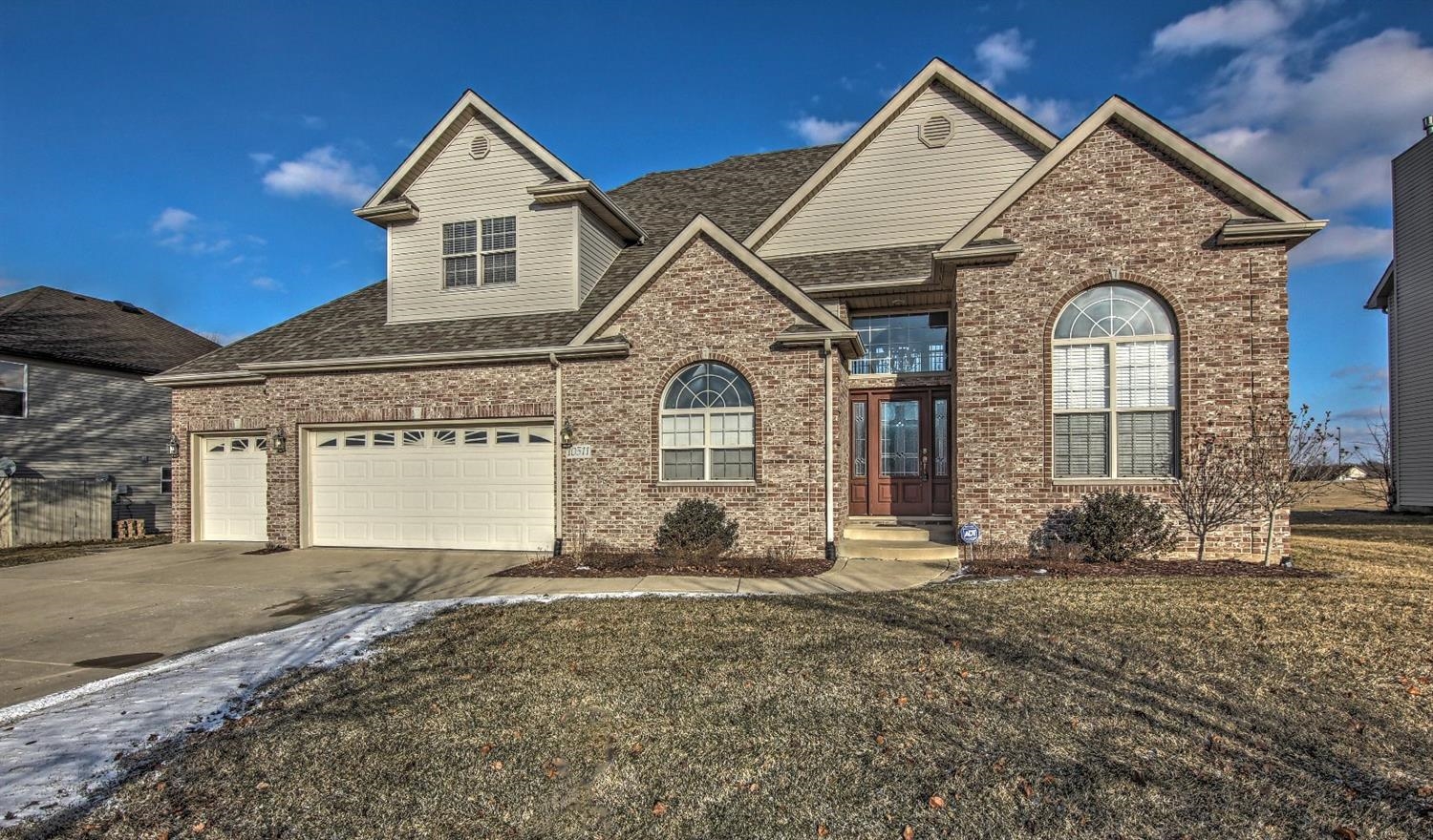 10511 Pike Street Crown Point, IN 46307 - Photo 1 of 26 a front view of a house with garden