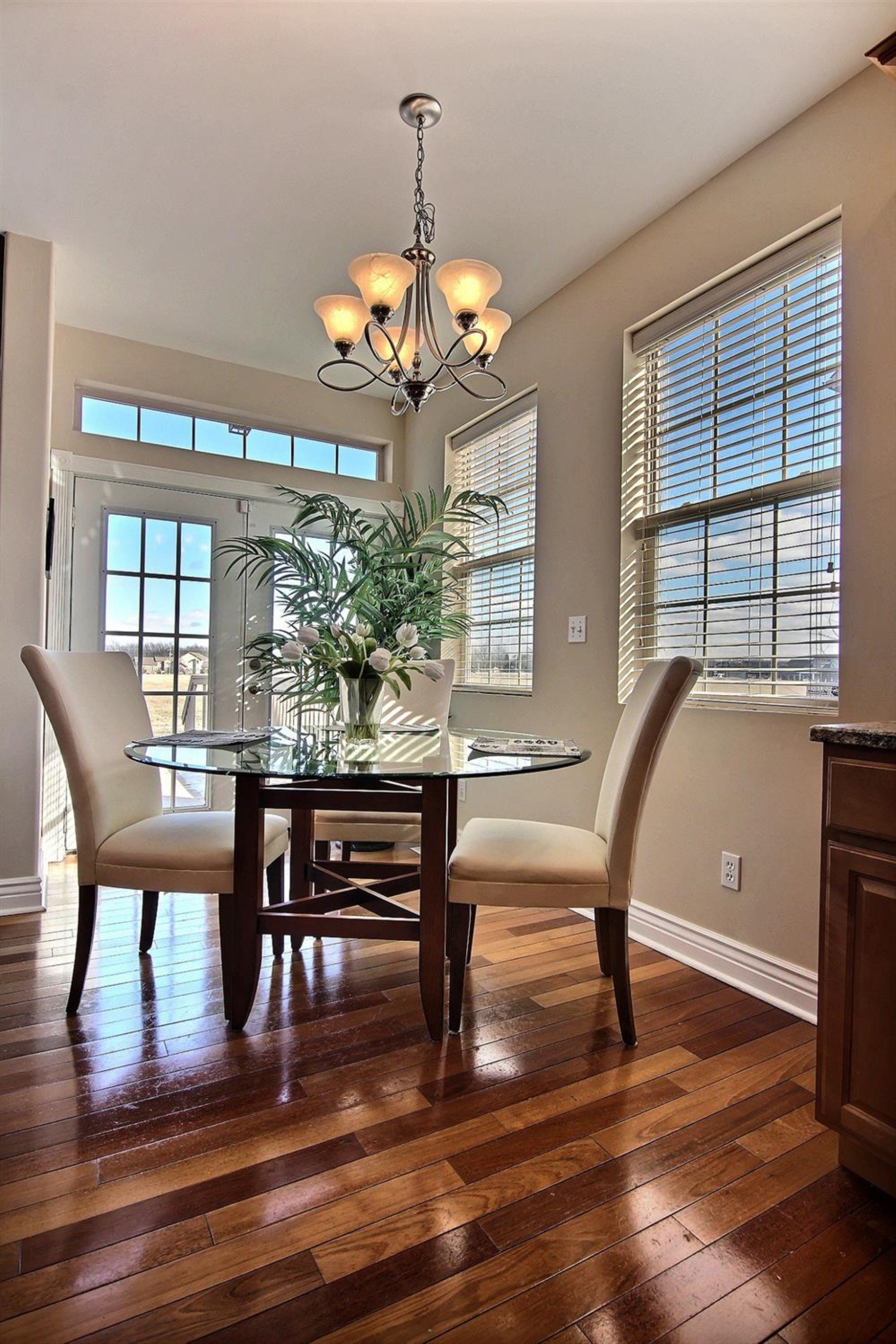 10511 Pike Street Crown Point, IN 46307 - Photo 12 of 26 a view of a dining room with furniture window and wooden floor
