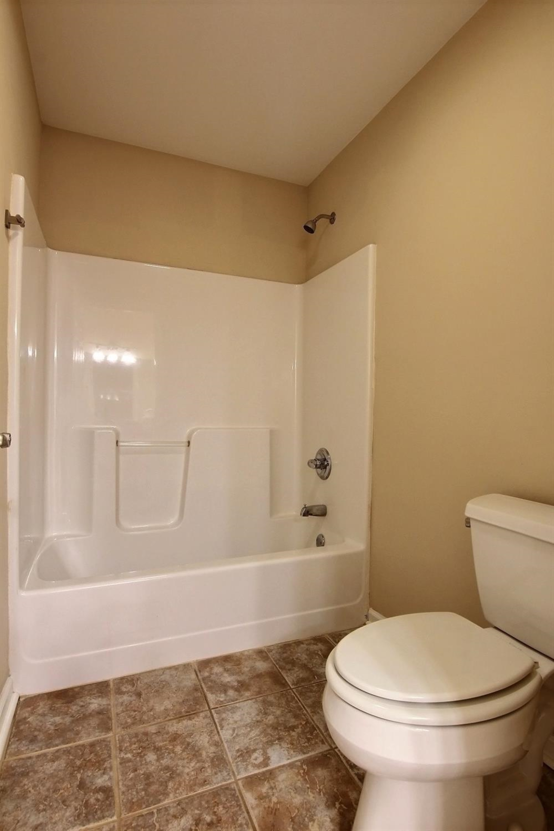10511 Pike Street Crown Point, IN 46307 - Photo 16 of 26 a bathroom with a toilet and a shower