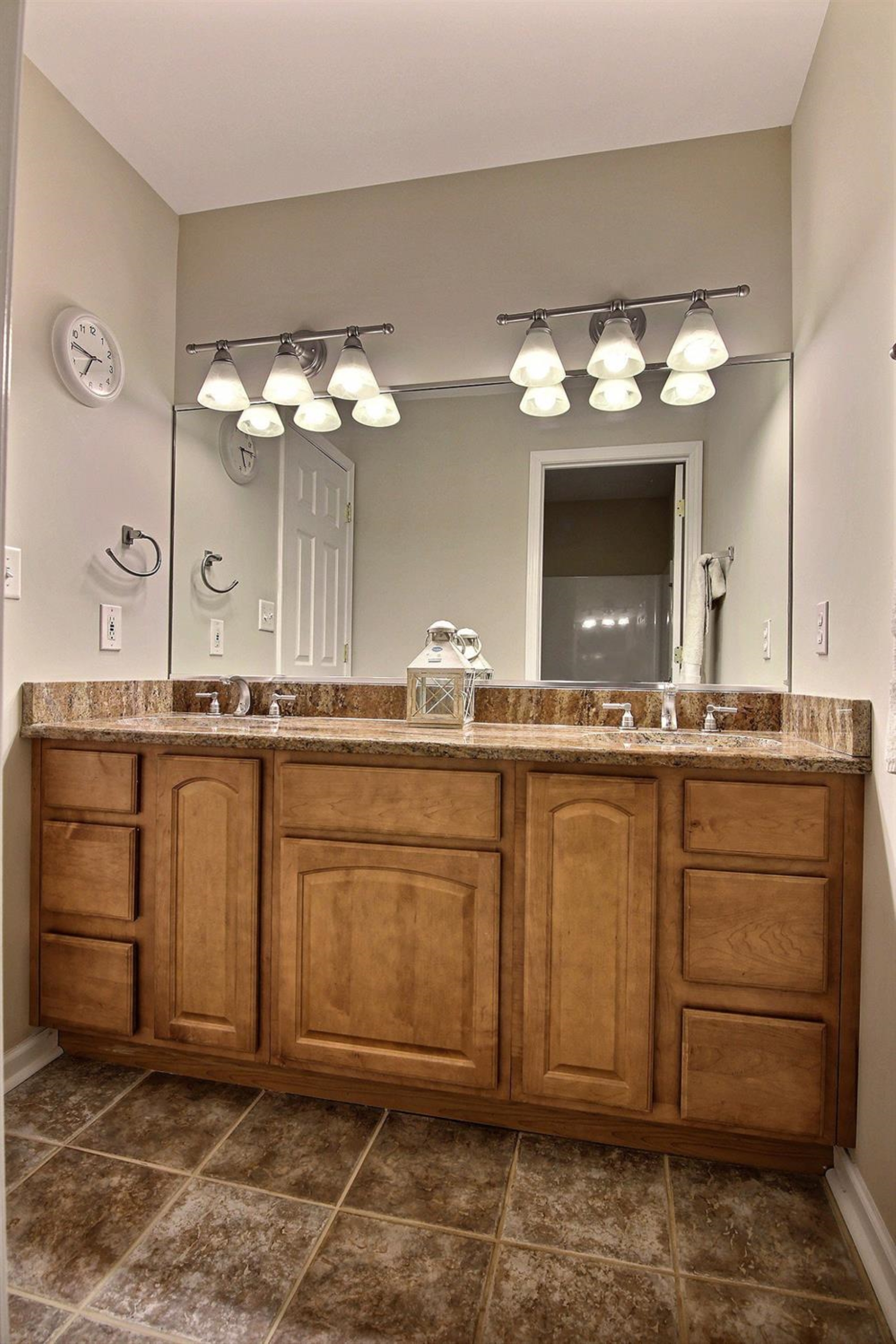 10511 Pike Street Crown Point, IN 46307 - Photo 18 of 26 a bathroom with a sink and a mirror