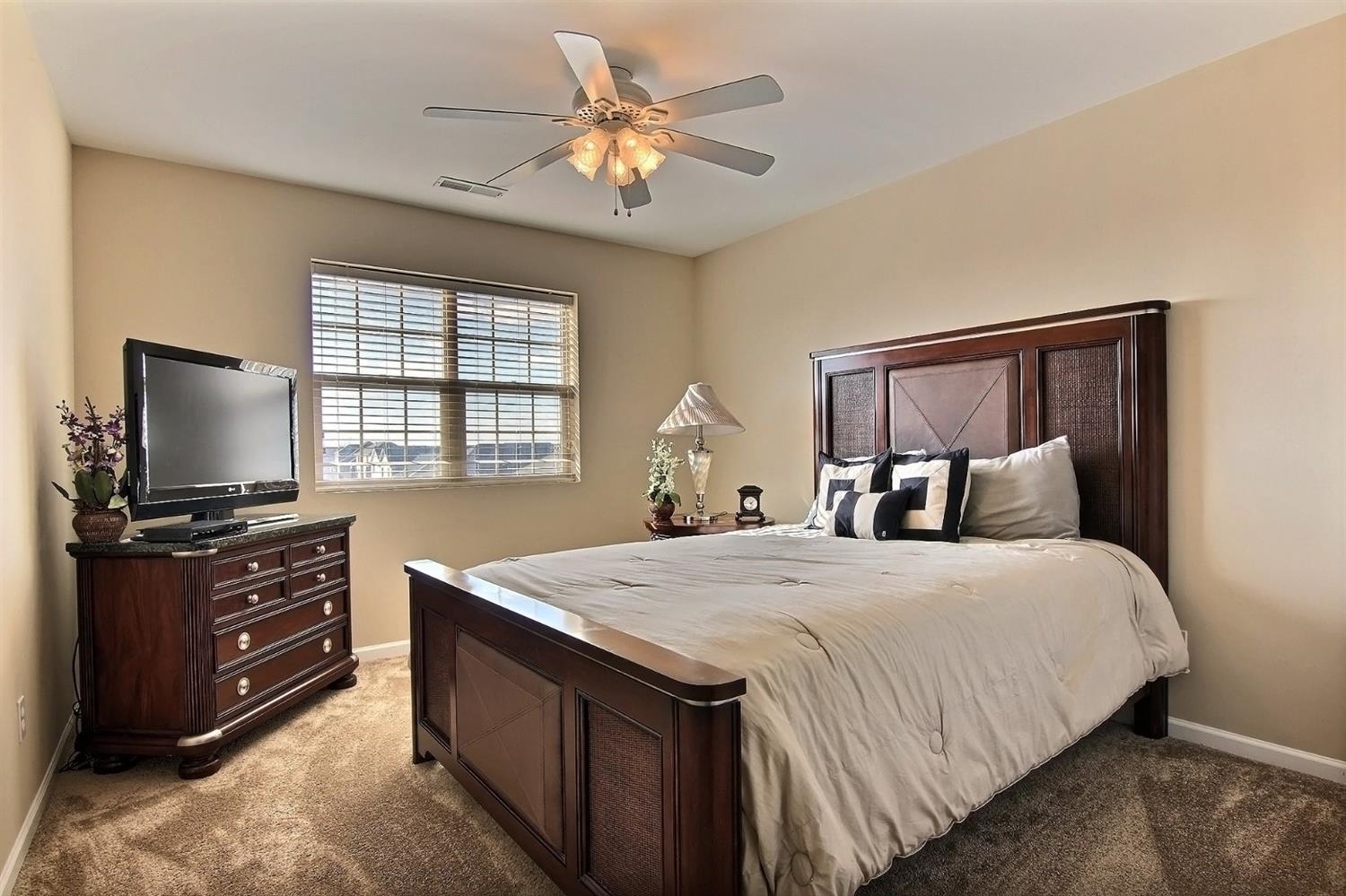 10511 Pike Street Crown Point, IN 46307 - Photo 19 of 26 a bedroom with a bed and a flat screen tv