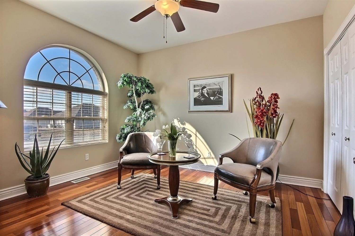 10511 Pike Street Crown Point, IN 46307 - Photo 5 of 26 a living room with furniture a table and a potted plant