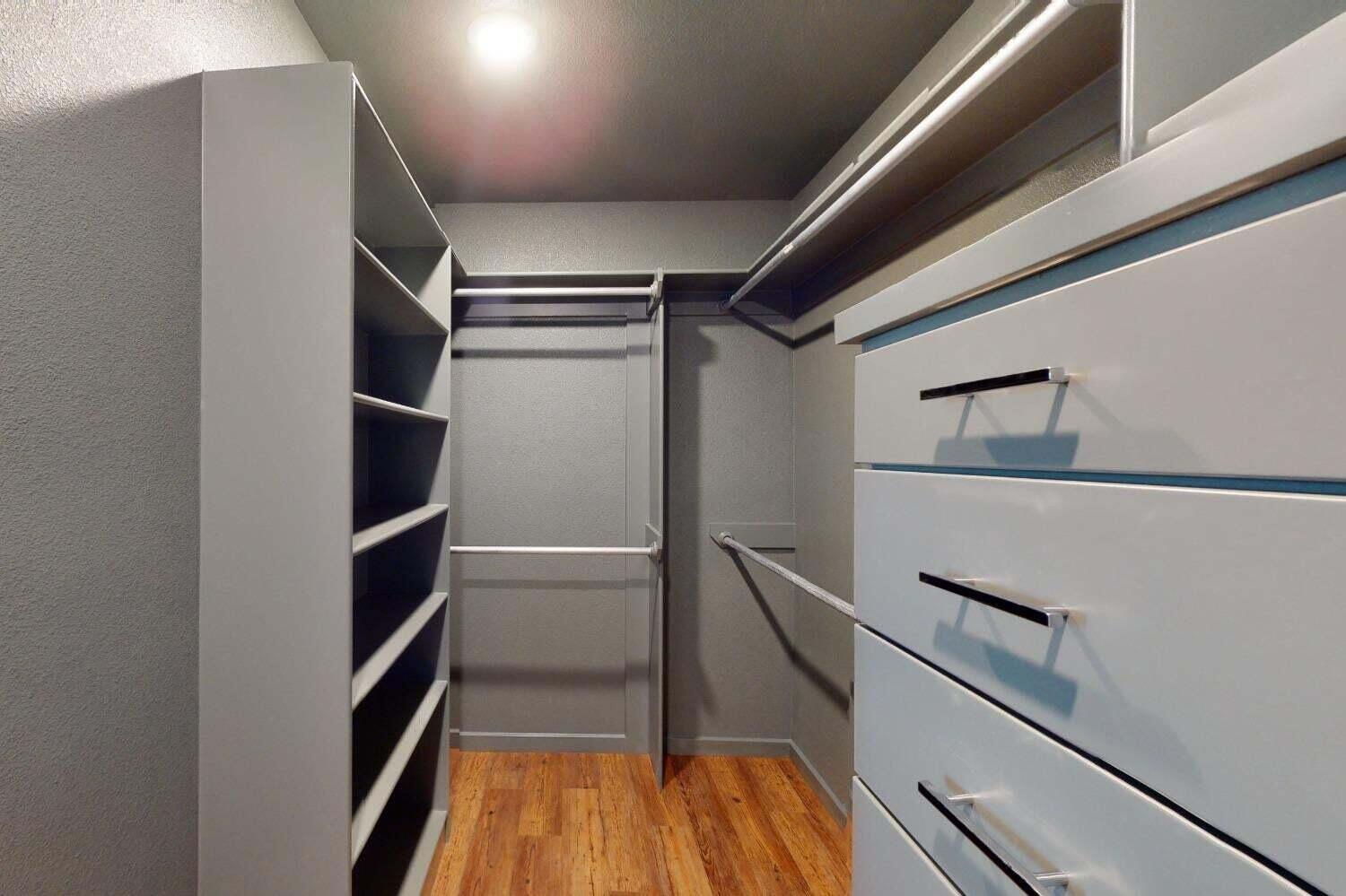 3617 128th Street Lubbock, TX 79423 - Photo 22 of 30 a view of walk in closet with empty racks