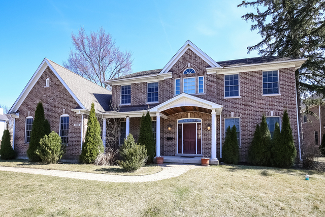 1059 Shermer Road Northbrook, IL 60062 - Photo 2 of 23 a front view of a house with yard