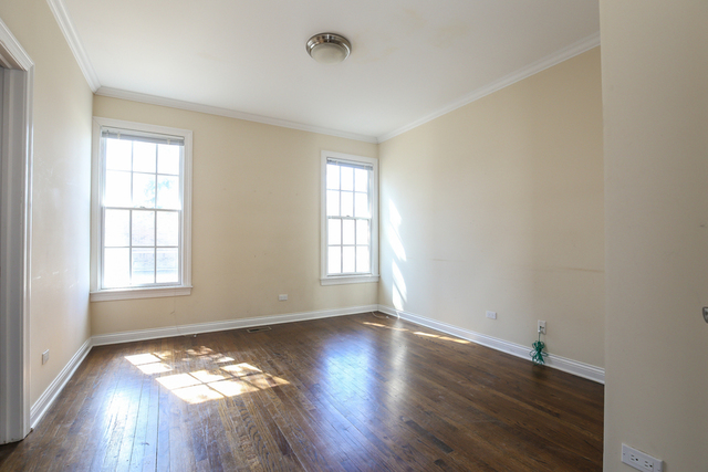 1059 Shermer Road Northbrook, IL 60062 - Photo 18 of 23 an empty room with wooden floor and windows