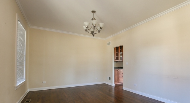 1059 Shermer Road Northbrook, IL 60062 - Photo 19 of 23 an empty room with wooden floor and windows