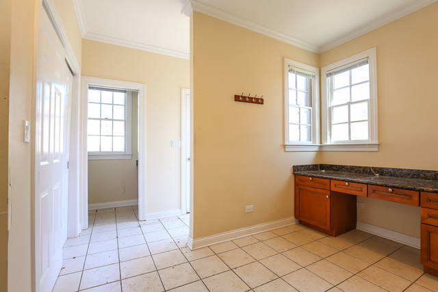 1059 Shermer Road Northbrook, IL 60062 - Photo 22 of 23 a view of a kitchen with wooden floor and electronic appliances