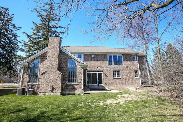 1059 Shermer Road Northbrook, IL 60062 - Photo 5 of 23 a front view of a house with a yard