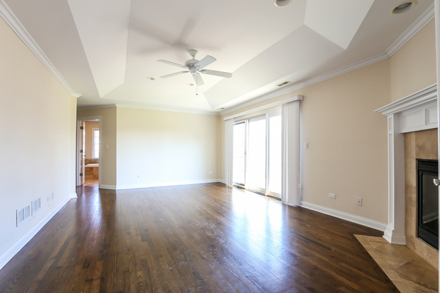 1059 Shermer Road Northbrook, IL 60062 - Photo 7 of 23 wooden floor in an empty room with a window