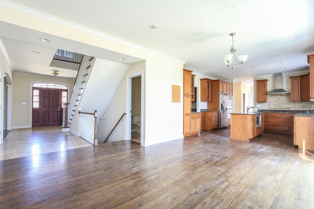 1059 Shermer Road Northbrook, IL 60062 - Photo 9 of 23 a view of a big room with wooden floor and windows