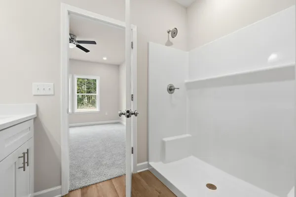 a bathroom with a tub and shower