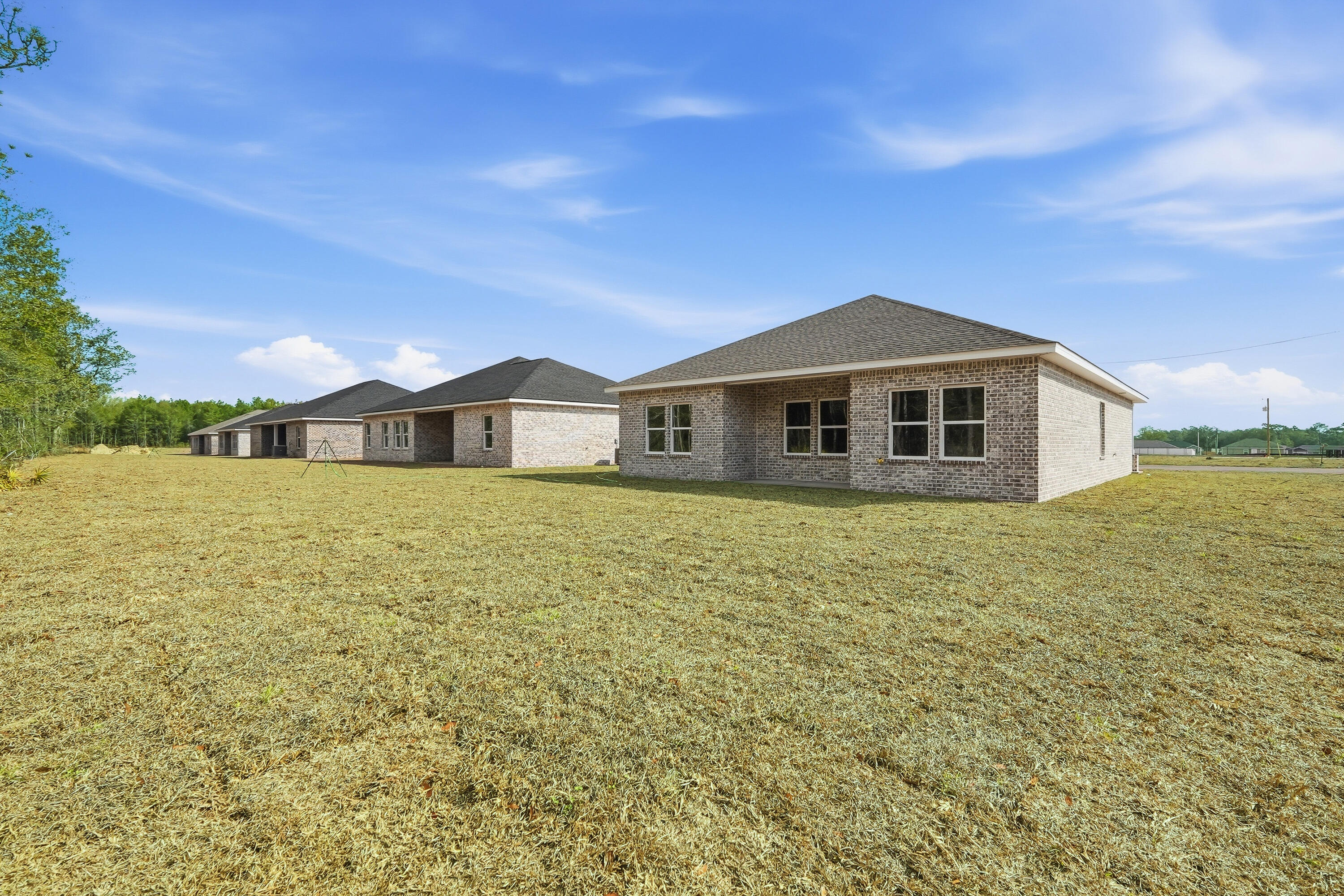 6102 Mildreds Way Crestview, FL 32539 - Photo 23 of 25 a front view of a house with a garden