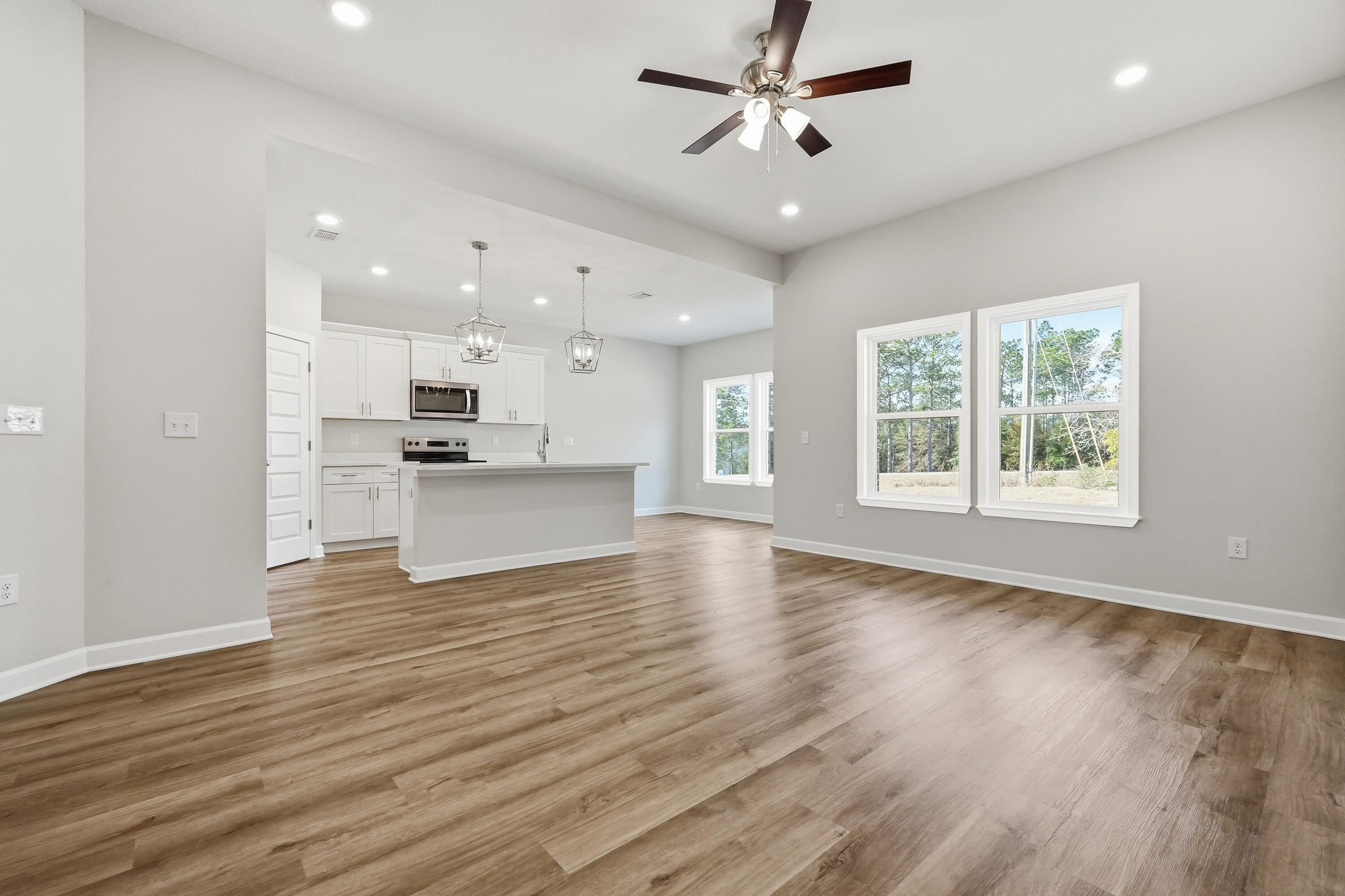 6102 Mildreds Way Crestview, FL 32539 - Photo 6 of 25 a view of kitchen with cabinets and wooden floor