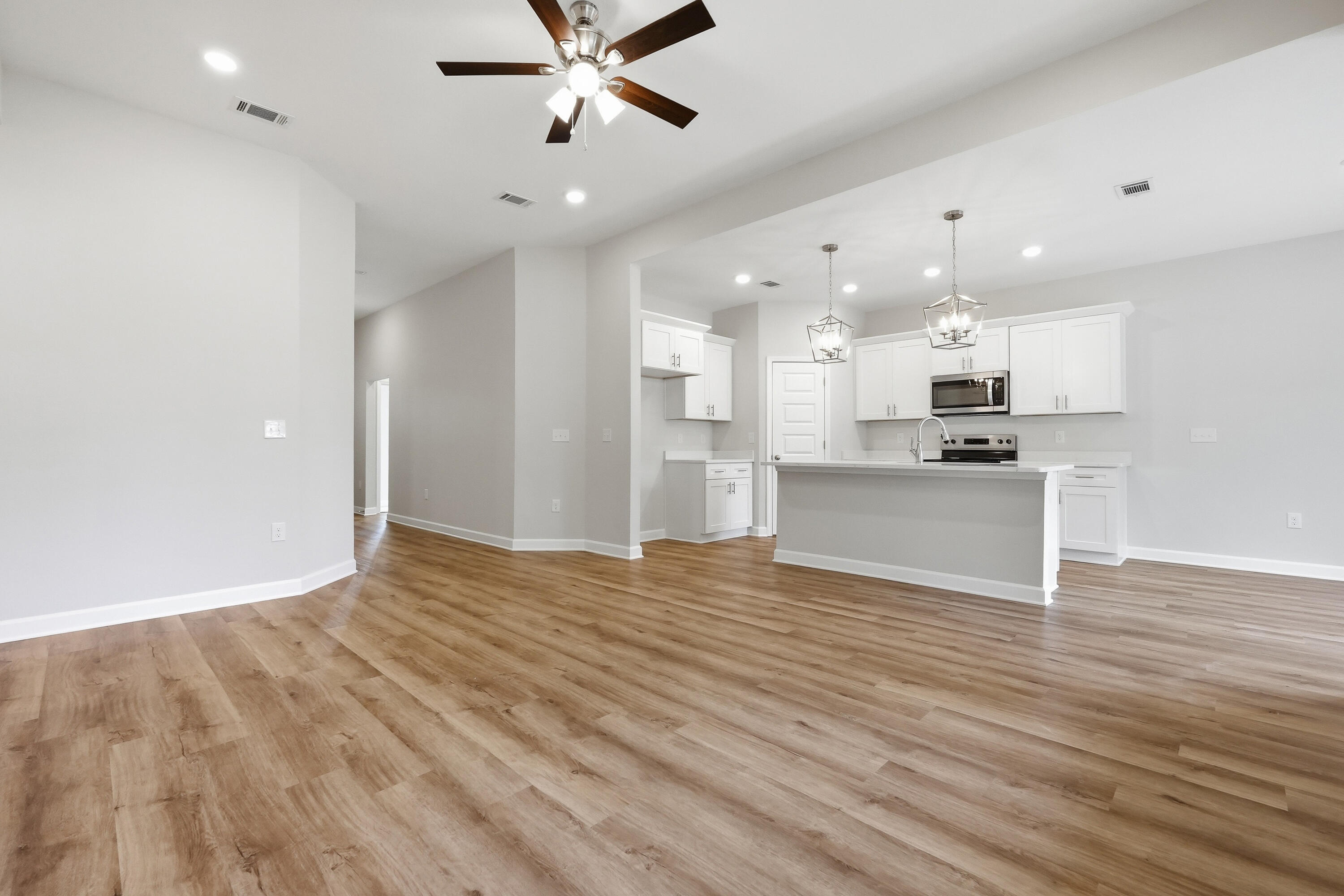 6102 Mildreds Way Crestview, FL 32539 - Photo 7 of 25 a view of a kitchen with a sink and a stove