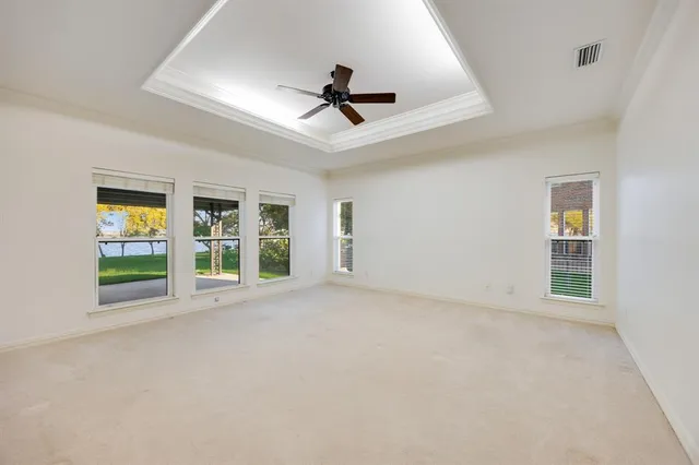 a spacious bathroom with a granite countertop sink a mirror and a shower