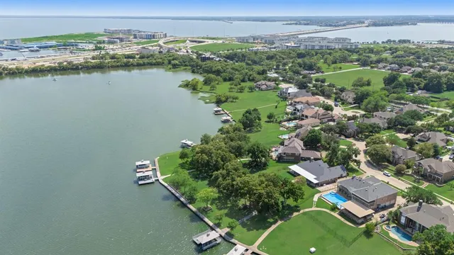 an aerial view of a house with a lake view