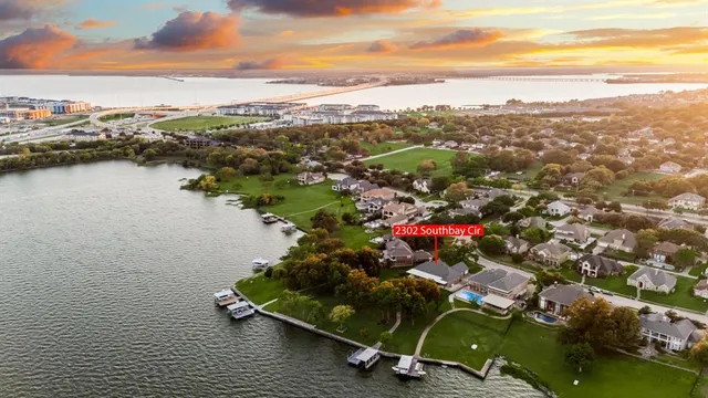 an aerial view of a houses with a yard