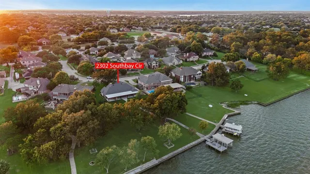 a view of a bedroom with wooden floor and closet
