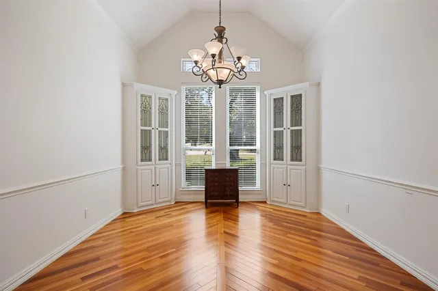a large kitchen with stainless steel appliances granite countertop a stove and a sink