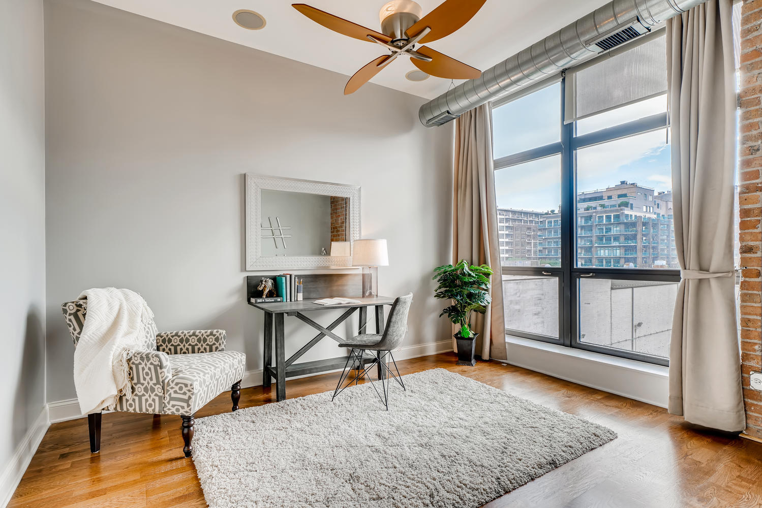 23 North Green Street, Unit 401 Chicago, IL 60607 - Photo 13 of 17 a living room with furniture and a table