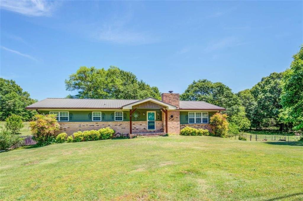 452 Keys Ferry Road Jackson, GA 30233 - Photo 1 of 1 a front view of a house with garden