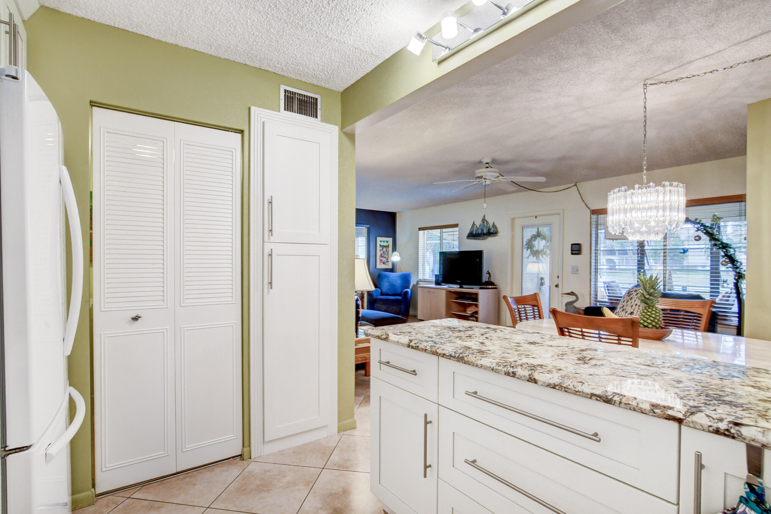 334 Pine Ridge Circle, Unit B1 Greenacres, FL 33463 - Photo 11 of 26 a large bathroom with a granite countertop sink and a mirror