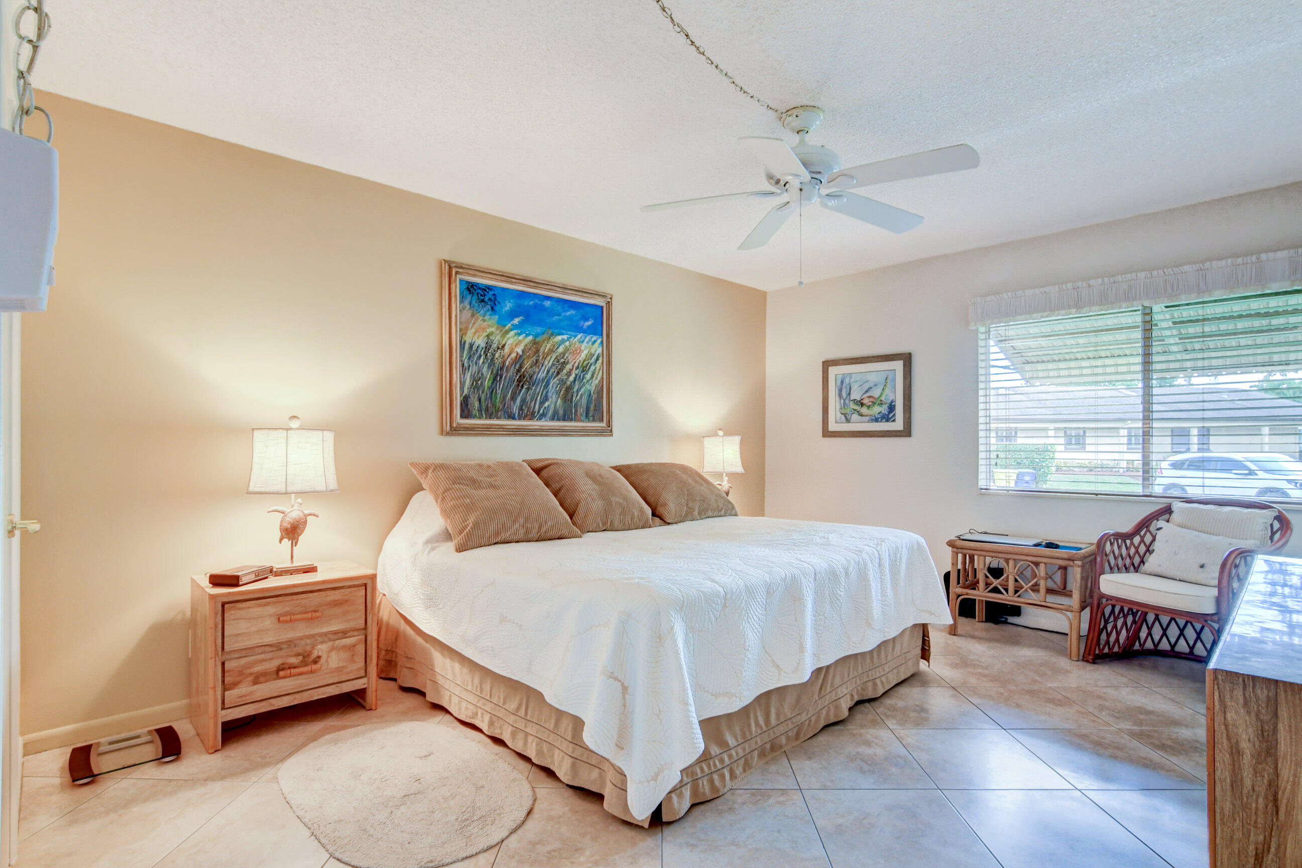 334 Pine Ridge Circle, Unit B1 Greenacres, FL 33463 - Photo 12 of 26 a spacious bedroom with a bed and a window