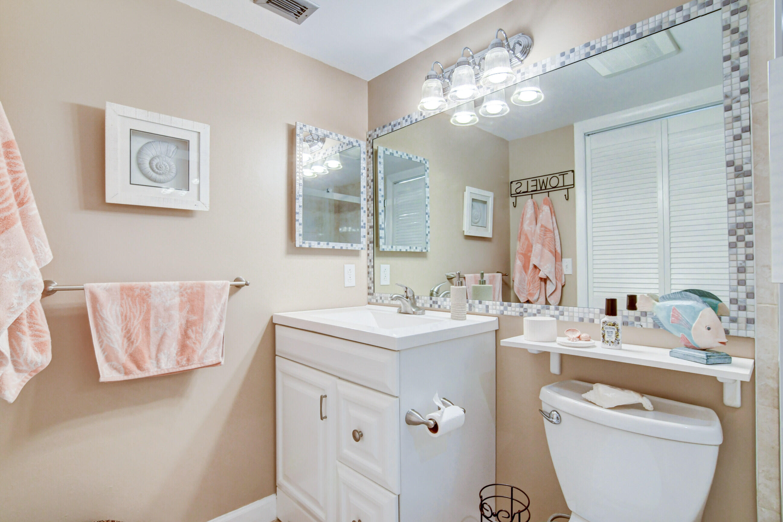334 Pine Ridge Circle, Unit B1 Greenacres, FL 33463 - Photo 15 of 26 a bathroom with a sink double vanity and a mirror
